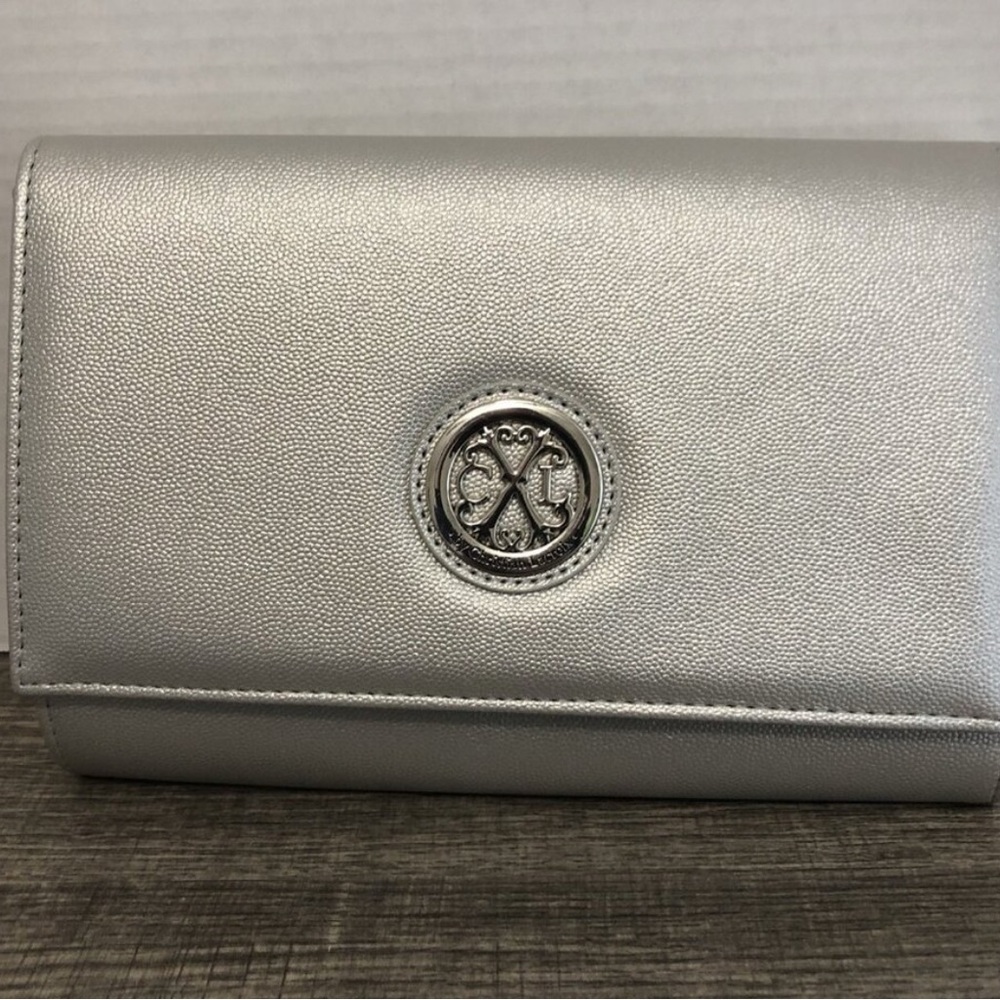 Elegant Christian LaCroix silver clutch with detachable strap